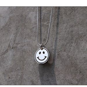 Smiling face necklace.